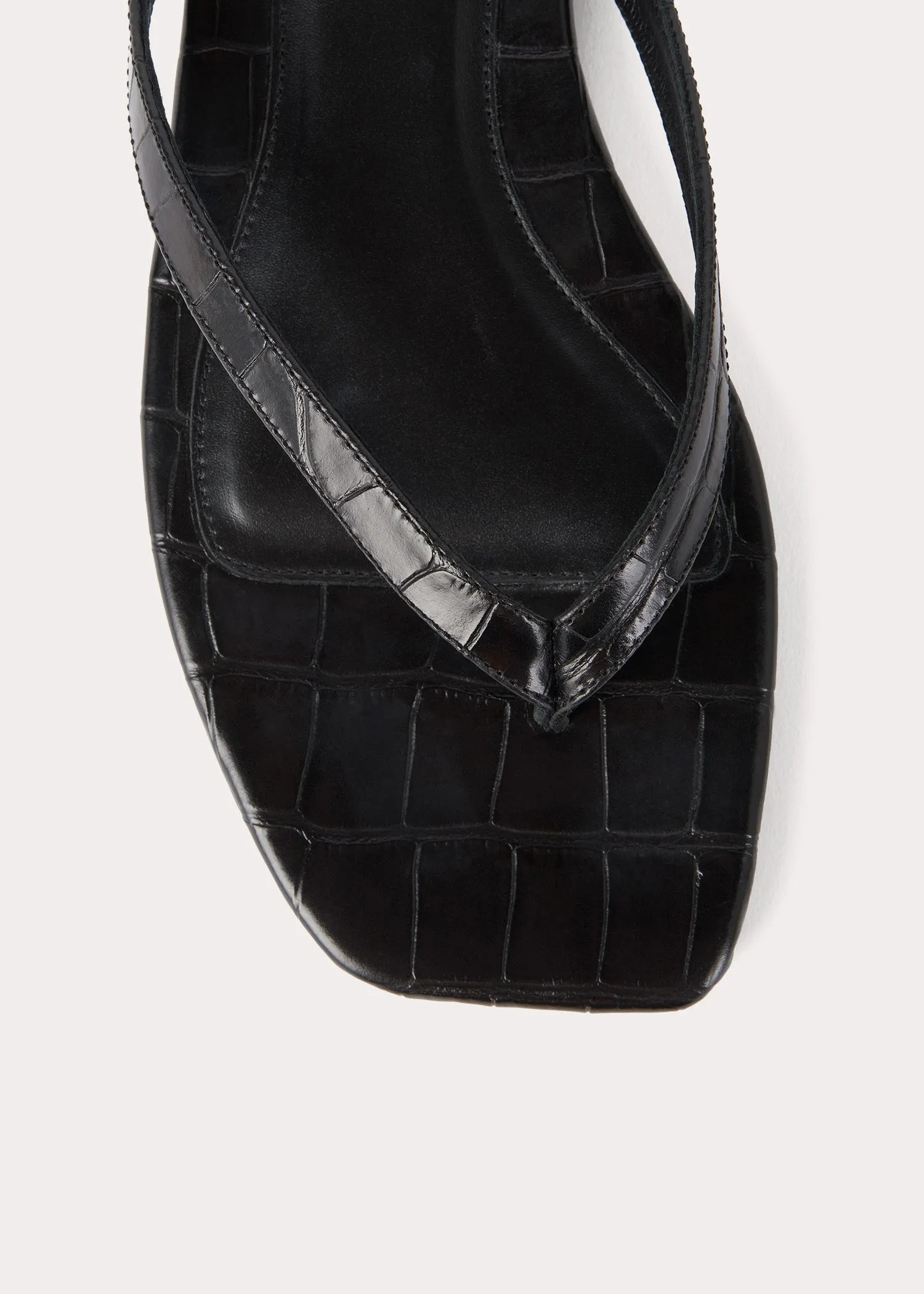 Croco-embossed flip flops black