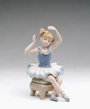 Porcelain Ballerina in Blue Dress Siting on Chair Figurine